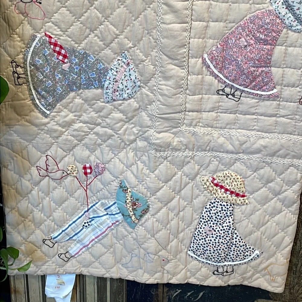Appliqued and embroidered quilt